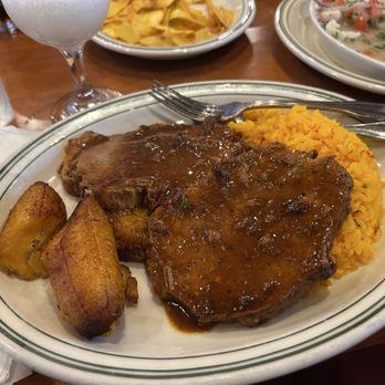 La Carreta Restaurant - Boliche entree (pork roast) with 2 sides: yellow rice and plátano maduros. - Cuban Near Me - Miami, Florida La Carreta Restaurant - Boliche entree (pork roast) with 2 sides: yellow rice and plátano maduros. - Cuban Near Me - Miami, Florida