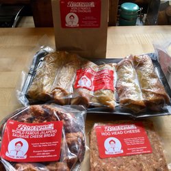 Bourque's Supermarket - Delicious and meaty cracklin', boudin eggrolls, jalapeño sausage bread and hogs head cheese