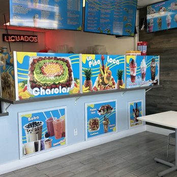 Freezzone Raspados - Inside of the establishment. No AC  not so Freezzone. Only a ceiling fan - Desserts Near Me - Pomona, California