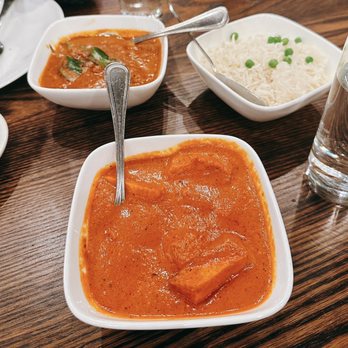 Benares - Chicken Tikka Masala (one closest to me) Andhra Chicken Curry (one behind the Chicken Tikka Masala) Plain Basmati Rice - Indian Near Me - New York, New York Benares - Chicken Tikka Masala (one closest to me) Andhra Chicken Curry (one behind the Chicken Tikka Masala) Plain Basmati Rice - Indian Near Me - New York, New York