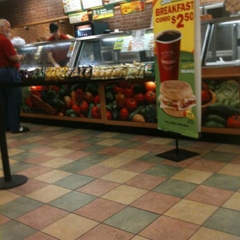 Subway - a woman standing in front of a food counter - Sandwiches Near Me - Perry, Florida Subway - a woman standing in front of a food counter - Sandwiches Near Me - Perry, Florida