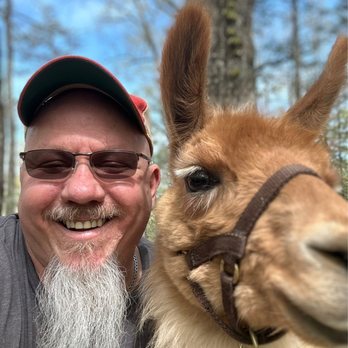 Smoky Mountain Llama Treks - My boyfriend with Dalai Llama! - Hiking Near Me - Cosby, Tennessee