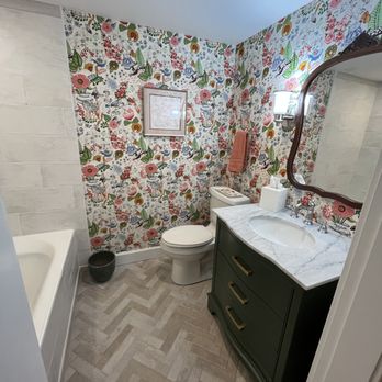 Mayflower Tile - After renovation. Old tile removed from floor and tub surround. New ceramic tiles for floor and walls. Note the floor herringbone layout - Tiling Near Me