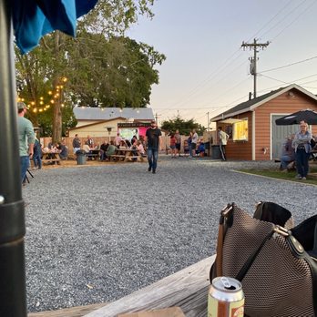 No Forks Given - people sitting at a picnic table - Food Trucks Near Me