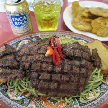 Don Julio Restaurant - Tallarin Verde with steak and tostones - Peruvian Near Me - Passaic, New Jersey