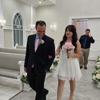 Walking back into the chapel after the ceremony to take pictures. Shout out to our photographer in the background! He was amazing!