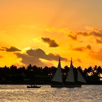 Sunset Pier - a sailboat in the water at sunset - Seafood Near Me - Key West, Florida