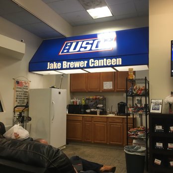 USO Airport Center - a man sitting in a recliner - Airport Lounges Near Me - Columbus, Ohio USO Airport Center - a man sitting in a recliner - Airport Lounges Near Me - Columbus, Ohio