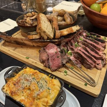 The Crunkleton - Tomahawk, roasted veggies, fingerling potatoes, grilled garlic bread, and Mac n Cheese. Amazing! - Cocktail Bars Near Me - Raleigh, North Carolina