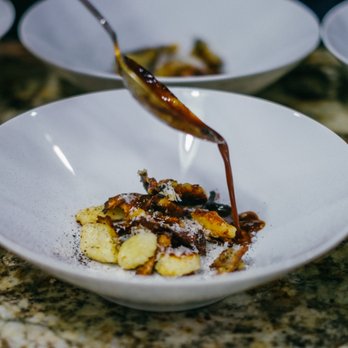 Family Table - Gnocchi, chanterelle mushrooms, parmiggiana-reggiano, rosemary and black garlic jus, dehydrated black garlic - Caterers Near Me Family Table - Gnocchi, chanterelle mushrooms, parmiggiana-reggiano, rosemary and black garlic jus, dehydrated black garlic - Caterers Near Me