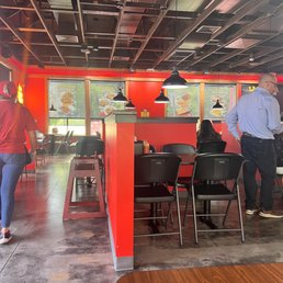 a group of people in a restaurant a group of people in a restaurant
