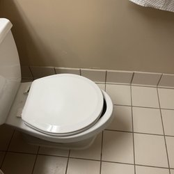 Quality Inn & Suites - Toilet seat isn't the right size.