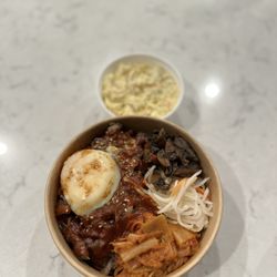 Riccup - Build your own bowl with Bulgogi, glass noodles, sautéed Kimchi, mushrooms, pickled radish, and poached egg.