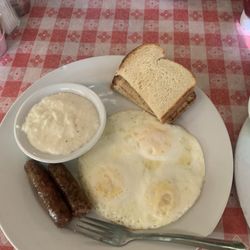 Bluffton General Store - Three eggs, two sausage links, a bowl of grits, and a side of buttered toast.