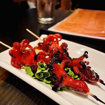 BarChi Sushi - skewered meat on a white plate - Sushi Bars Near Me - Austin, Texas BarChi Sushi - skewered meat on a white plate - Sushi Bars Near Me - Austin, Texas