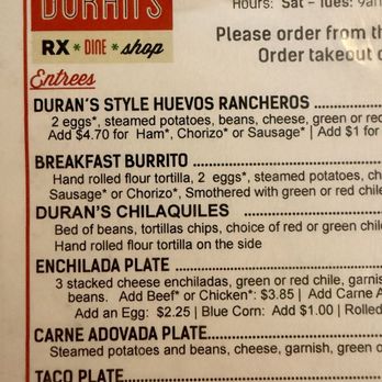 Duran Central Pharmacy - The menu from Duran's restaurant displays a list of Mexican and breakfast dishes, including huevos rancheros, breakfast burritos, chilaquiles, and enchiladas. It provides descriptions of ingredients, options for customization, and pricing details. The menu is printed on paper with a red and white header, and the restaurant's name is prominently displayed at the top. - Mexican Near Me - Albuquerque, New Mexico