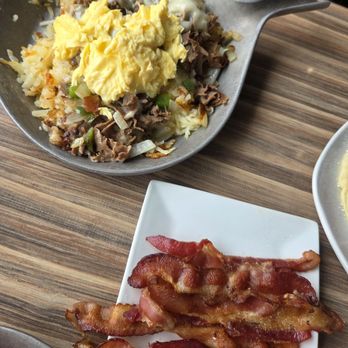 Eggsclusive Cafe - Philly skillet with Swiss cheese instead of Monterey jack. Side of bacon. - Breakfast & Brunch Near Me - Rockford, Illinois