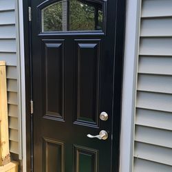 Sage Home Improvements - Outswinging custom sized steel entry door.