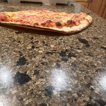 Castello of Niantic - a pizza on a counter - Pizza Near Me - Niantic, Connecticut Castello of Niantic - a pizza on a counter - Pizza Near Me - Niantic, Connecticut