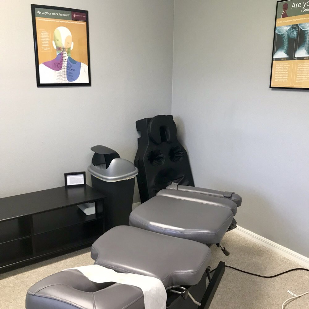 Optilife Chiropractic - Chiropractic chair in one of the rooms. - Chiropractors Near Me - Tampa, Florida