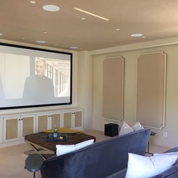 Wire Me Smart - Home theater install: projector, screen, subwoofer, smart remote programming, surround sound speakers Theater design: carpet walls & chairs - Home Automation Near Me Wire Me Smart - Home theater install: projector, screen, subwoofer, smart remote programming, surround sound speakers Theater design: carpet walls & chairs - Home Automation Near Me