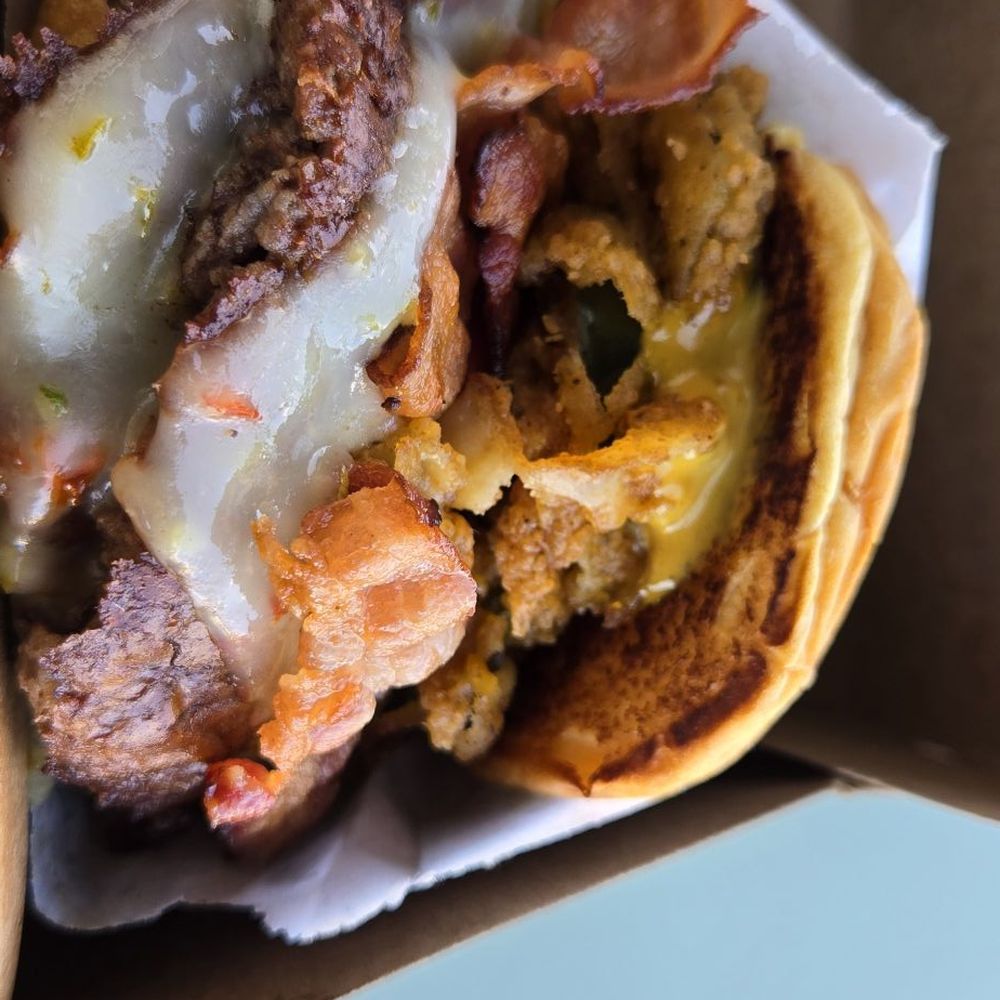 Double Carolina BBQ Burger. Lots of beef, lots of cheese, some bacon, some fried pickles. Great burger! Absolutely delicious! Double Carolina BBQ Burger. Lots of beef, lots of cheese, some bacon, some fried pickles. Great burger! Absolutely delicious!