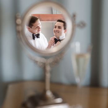 Suess Moments - creative gay wedding portrait getting ready with small mirror - Event Photography Near Me Suess Moments - creative gay wedding portrait getting ready with small mirror - Event Photography Near Me