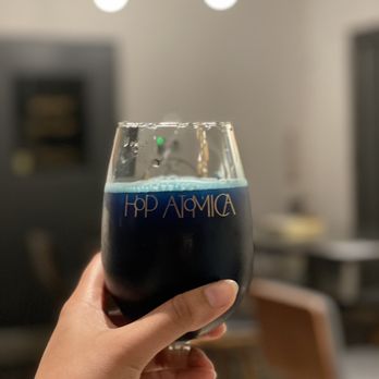 Hop Atomica - a hand holding a glass of beer - Breweries Near Me - Savannah, Georgia Hop Atomica - a hand holding a glass of beer - Breweries Near Me - Savannah, Georgia