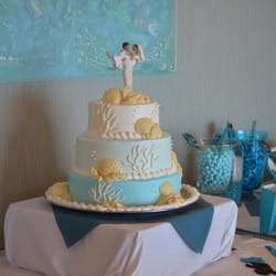Blue Dolfin Sweets - Our Wedding Cake - It was not only beautiful it was delicious! It was pound cake with butter cream icing - the shells were white chocolate.