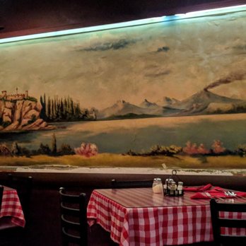 Caruso's - Paintings that pair well with the checkered tablecloths - Pizza Near Me - Tucson, Arizona