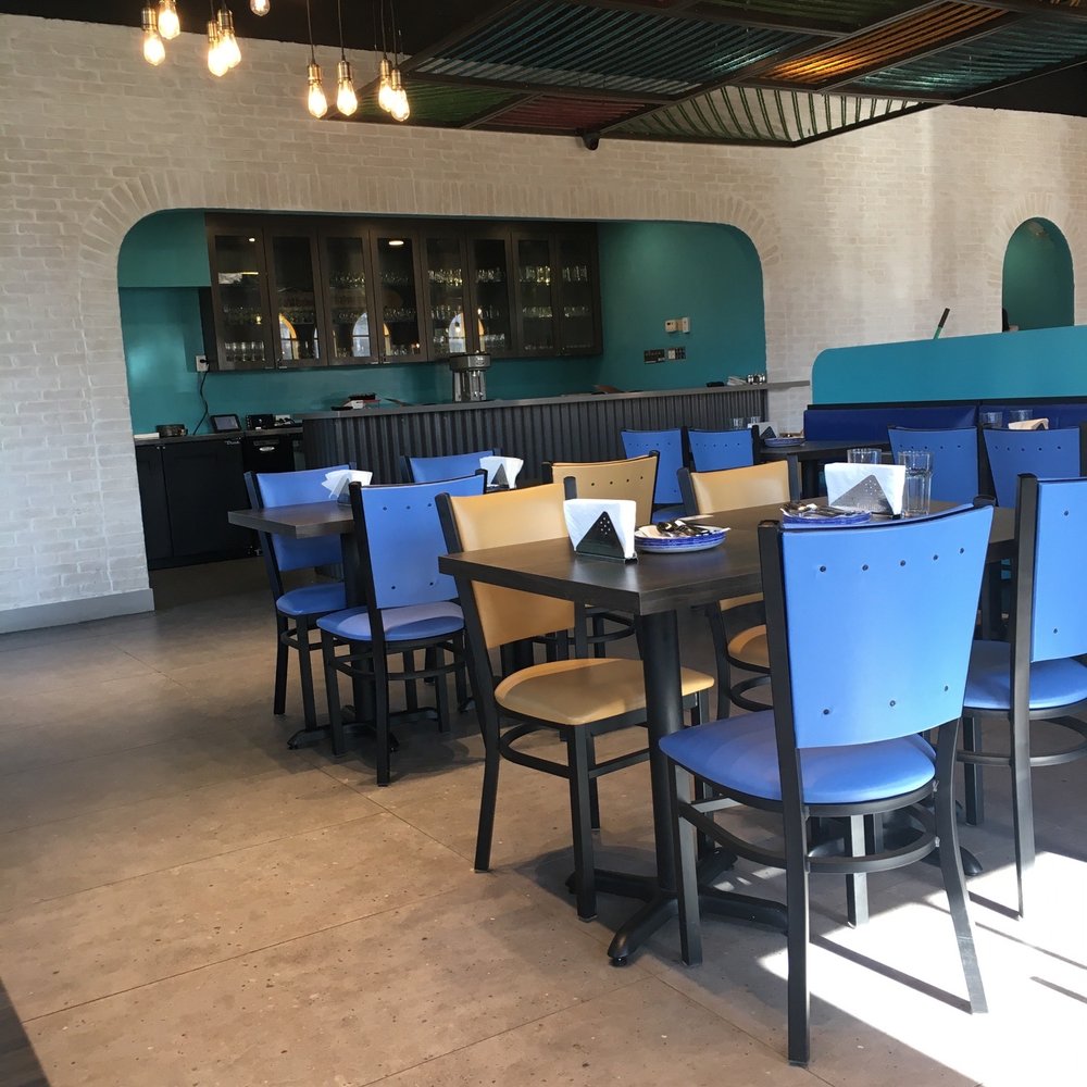 Amritsari Dhaba - a dining area with blue chairs - Indian Near Me - Brampton, Ontario Amritsari Dhaba - a dining area with blue chairs - Indian Near Me - Brampton, Ontario