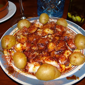 Rincon Escondido Tapas - Close-up of pulpo a la gallega (octopus). - Spanish Near Me - Miami, Florida