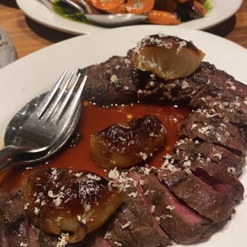 Nightingale - Roasted carrots on top, sirloin steak on bottom with onions - Live/Raw Food Near Me - Vancouver, British Columbia