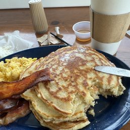 Buttermilk pancakes, eggs, bacon, coffee.