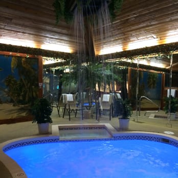 Sybaris Pool Suites - Pool area and the connecting hot tub. Be warned though. The "waterfall" is more like a tropical rain feature. - Hotels Near Me - Northbrook, Illinois Sybaris Pool Suites - Pool area and the connecting hot tub. Be warned though. The "waterfall" is more like a tropical rain feature. - Hotels Near Me - Northbrook, Illinois