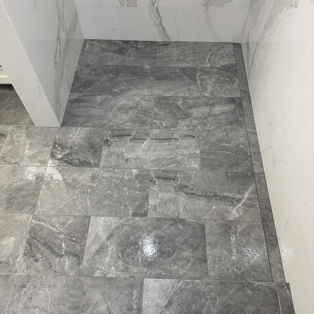 Barrett Tile - Tiled in linear ("infinity" drain is amazing) - Tiling Near Me