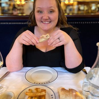 Bouchon - Wife enjoying foie gras with the bar behind her. - French Near Me - Las Vegas, Nevada