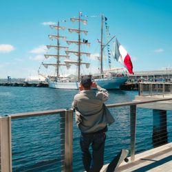 A person taking a photo of the Mexican Marine Ship