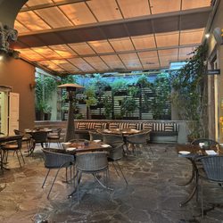 The Restaurant - The back dining area with retractable patio roof