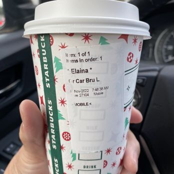 Starbucks - a person holding a cup of coffee - Coffee & Tea Near Me - East Meadow, New York Starbucks - a person holding a cup of coffee - Coffee & Tea Near Me - East Meadow, New York