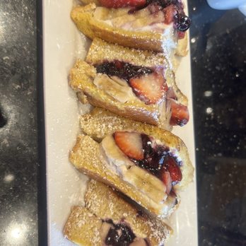 Keke's Breakfast Cafe - Stuffed French toast with apples, blueberries, and bananas - Breakfast & Brunch Near Me - Orlando, Florida Keke's Breakfast Cafe - Stuffed French toast with apples, blueberries, and bananas - Breakfast & Brunch Near Me - Orlando, Florida