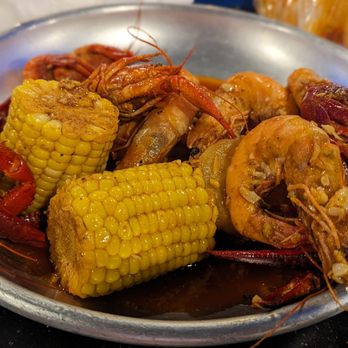 Rocking Crab - a plate of cooked shrimp and corn - Bars Near Me - St Petersburg, Florida Rocking Crab - a plate of cooked shrimp and corn - Bars Near Me - St Petersburg, Florida