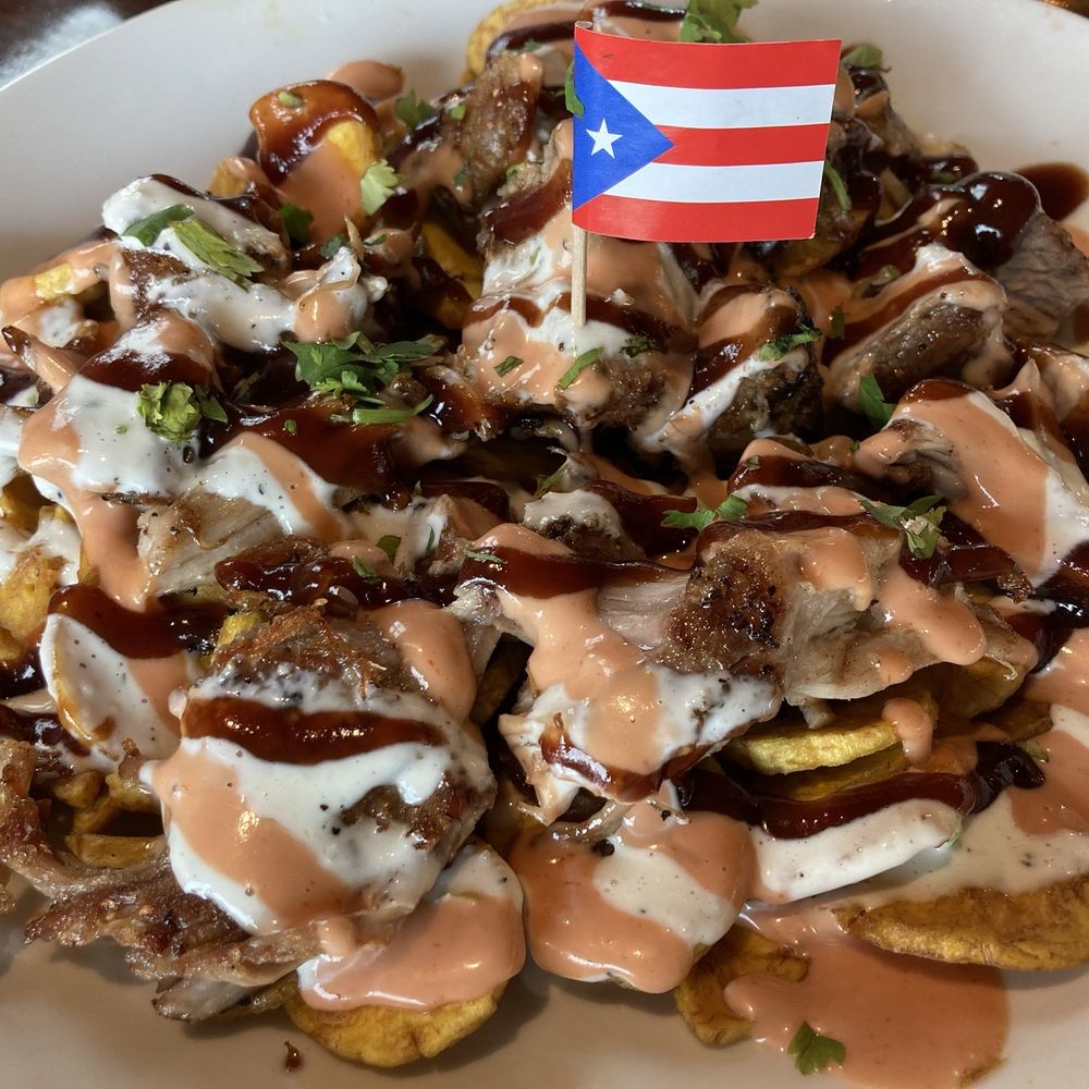 Elie’s Chinchorro - Plantain chips, pork, sauces. I can't remember the name and was NOT a fan of - Puerto Rican Near Me - Omaha, Nebraska Elie’s Chinchorro - Plantain chips, pork, sauces. I can't remember the name and was NOT a fan of - Puerto Rican Near Me - Omaha, Nebraska