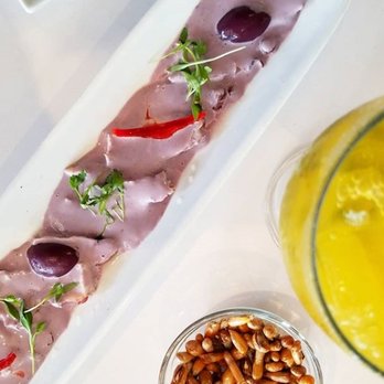 Dr Limon Ceviche Bar - Pulpo al Olivo: sliced octopus in kalamata olive sauce. - Seafood Near Me - Miami, Florida