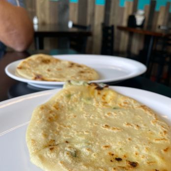 Pupusas Lover 2 - two flatbreads on plates - Salvadoran Near Me - Boulder, Colorado