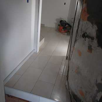 Richard Crum - a room with a white tile floor - General Contractors Near Me Richard Crum - a room with a white tile floor - General Contractors Near Me