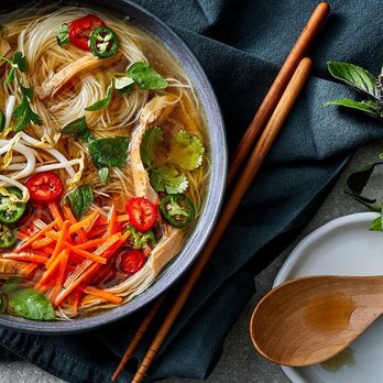 Pho Bar and Grill - a bowl of chicken noodle with chopsticks - Vietnamese Near Me - Colorado Springs, Colorado Pho Bar and Grill - a bowl of chicken noodle with chopsticks - Vietnamese Near Me - Colorado Springs, Colorado
