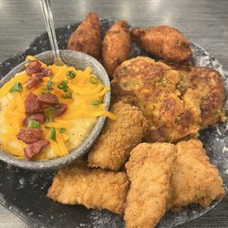 Mahi, wharf cakes, hush puppies and loaded grits