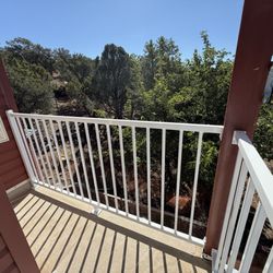 Western Fence Company - White standard custom railing on the second floor of a house in Central, Utah.