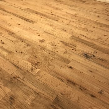 Floor N More Southlake - Wrong stain removed showing the inferior material used with excessive knot holes, insect holes and filings from sharpening their tools. - Flooring Near Me - Southlake, Texas Floor N More Southlake - Wrong stain removed showing the inferior material used with excessive knot holes, insect holes and filings from sharpening their tools. - Flooring Near Me - Southlake, Texas